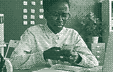 A woman at her desk reading a reply on her phone